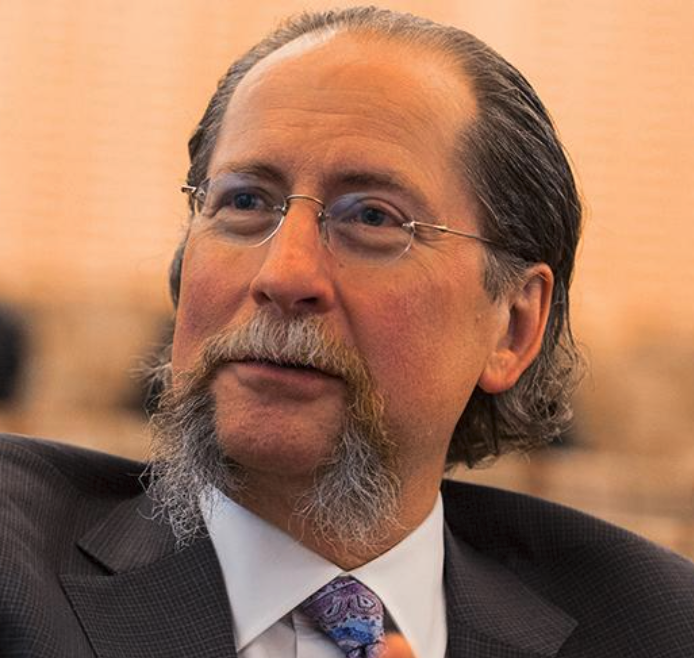 headshot of Dr Montgomery in a shirt and tie